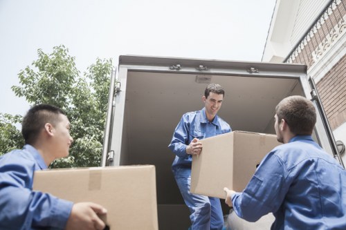 Movers team protecting furniture during a safe Belgravia relocation