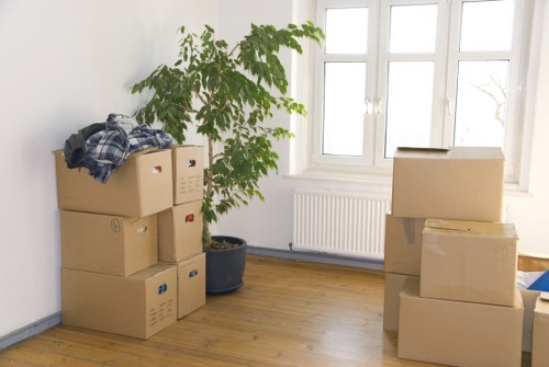 Movers packing delicate household items for a Belgravia relocation
