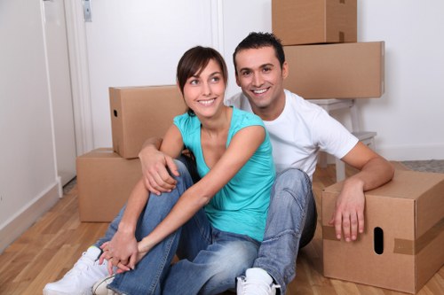 Team using PPE while moving boxes and furniture safely