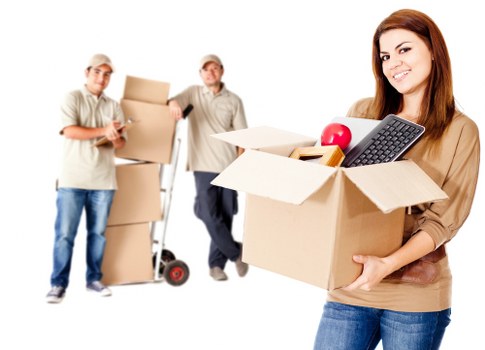 Mover carrying a wrapped piece of furniture safely