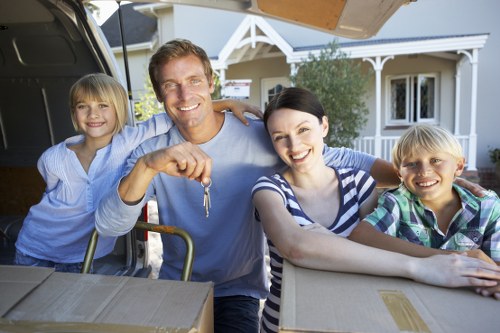 Professional movers packing boxes for a house removal in Belgravia