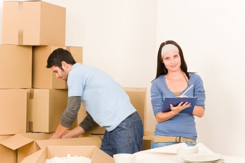 Movers handling packed boxes with care during a relocation