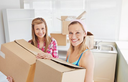 A professional moving team following health and safety procedures
