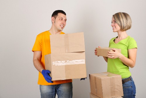 Staff completing a safety check before lifting furniture